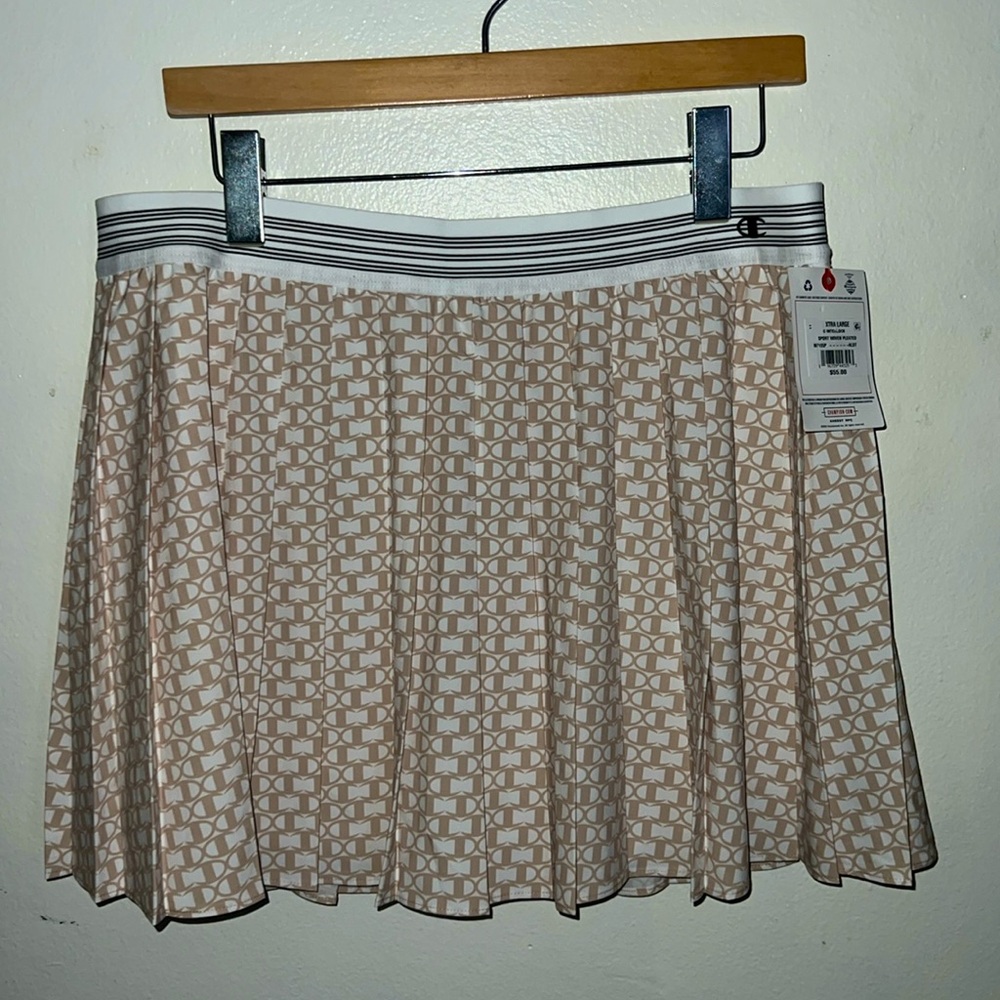 NWT Champion pleated skirt. Size: L. Color: cream and white C logo all o…